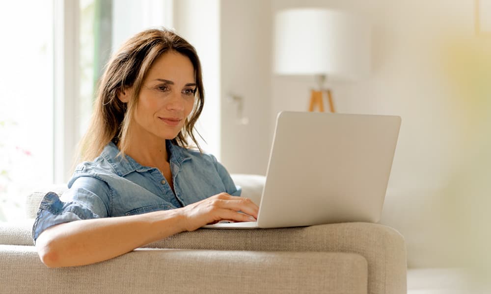 woman using her computer to schedule an appointment