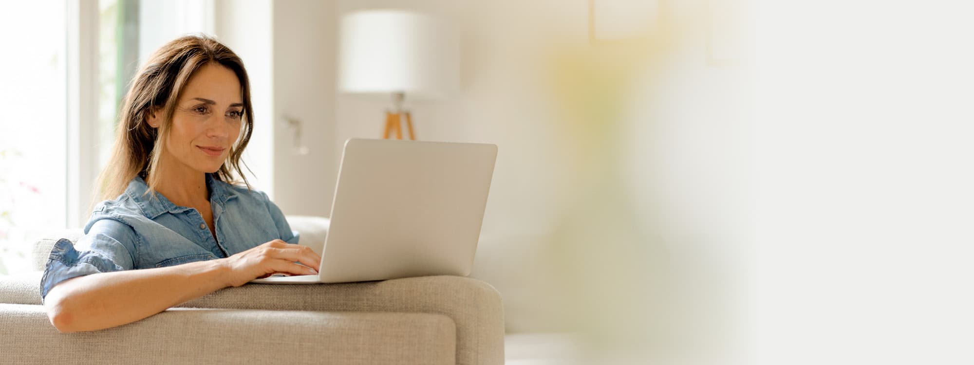 woman using her computer to schedule an appointment